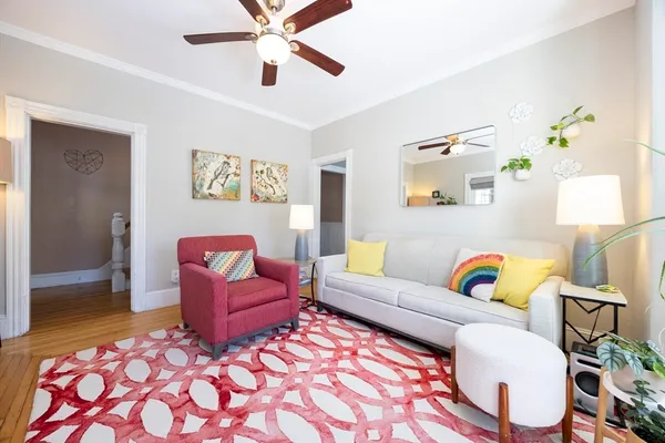 a living room with furniture and a rug