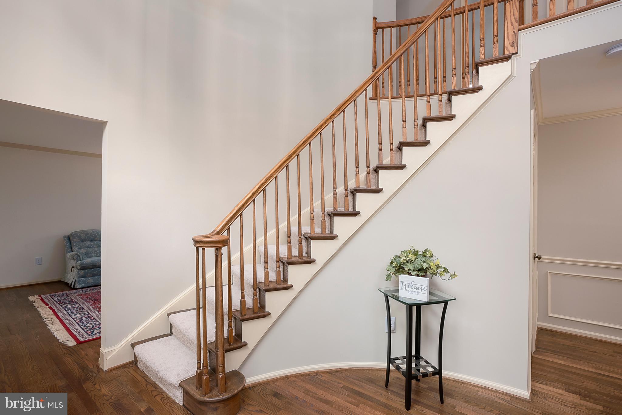 5208 Durham Road East Columbia, MD 21044 - Photo 4 of 36 a view of entryway with wooden floor and stairs