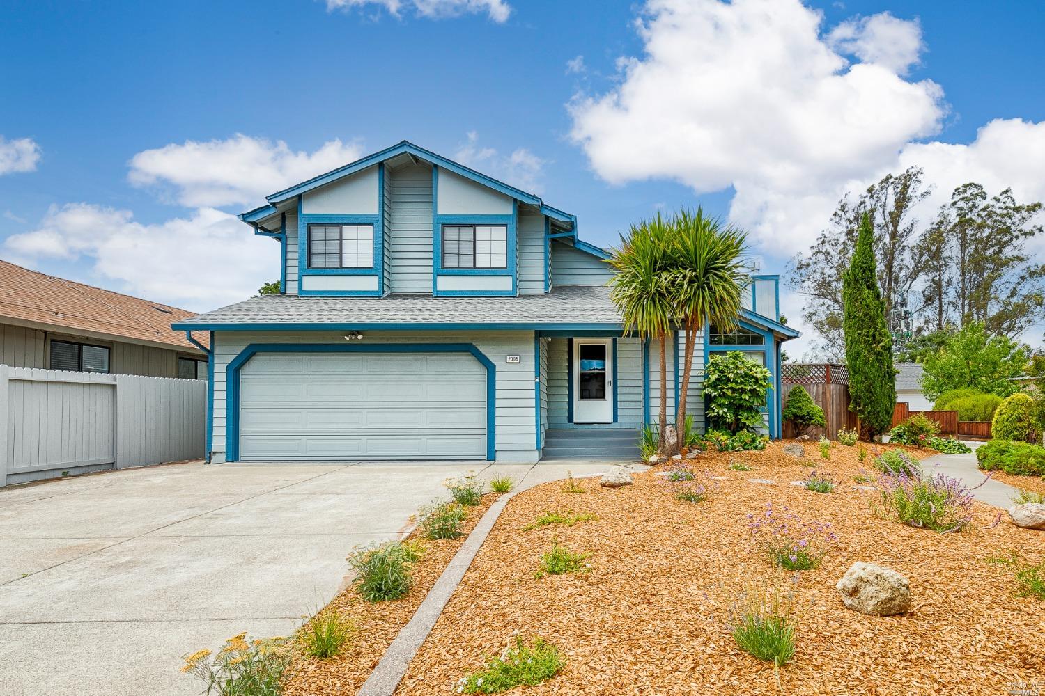 2005 Quail Run Santa Rosa, CA 95403 - Photo 1 of 1 a front view of a house with a yard and garage