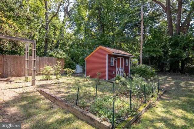 a backyard of a house with yard and outdoor seating