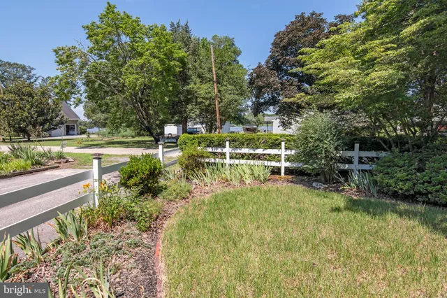 a view of yard with green space and seating area