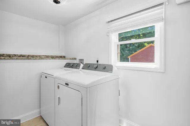 a utility room with washer and dryer