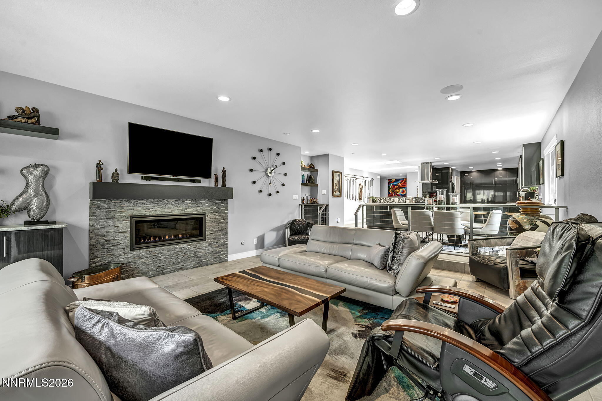 4865 Lakeridge Terrace West Reno, NV 89509 - Photo 8 of 51 a living room with furniture a flat screen tv and a fireplace