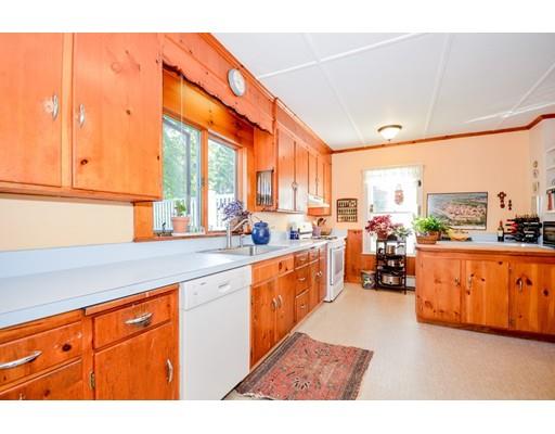300 Converse Road Marion, MA 02738 - Photo 15 of 35 a open kitchen with stainless steel appliances granite countertop a stove a sink and a refrigerator