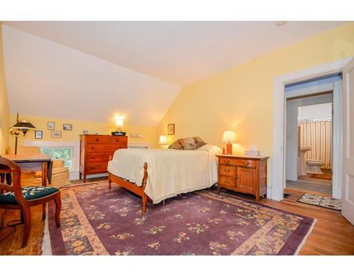300 Converse Road Marion, MA 02738 - Photo 23 of 35 a bedroom with a bed a table and chair