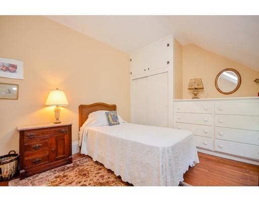300 Converse Road Marion, MA 02738 - Photo 24 of 35 a bedroom with a bed and a mirror