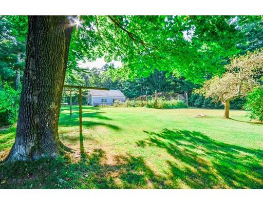 300 Converse Road Marion, MA 02738 - Photo 30 of 35 a view of a garden with a bench