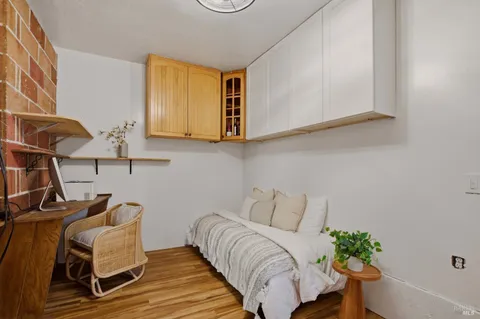 a bedroom with a bed and cabinets