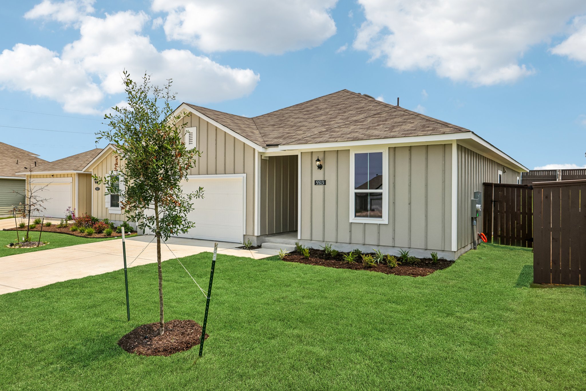 5513 Sacra Cove Austin, TX 78747 - Photo 5 of 37 a view of a house with backyard and garden