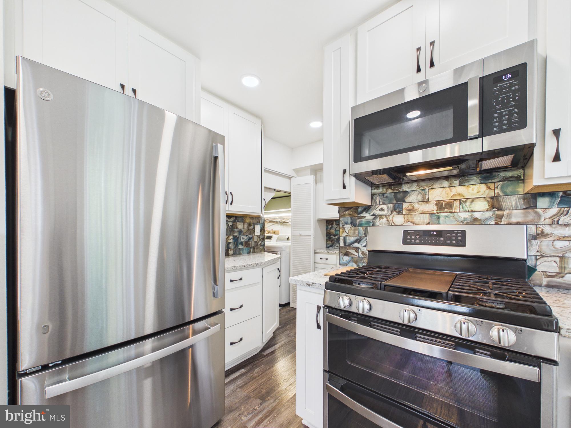 5512 Kathleen Place Springfield, VA 22151 - Photo 16 of 42 Sleek modern kitchen with stainless steel.