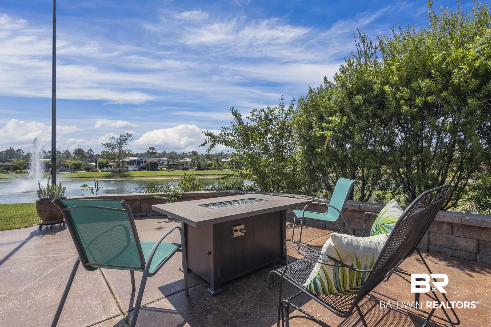 212 Magnifico Drive Foley, AL 36535 - Photo 11 of 50 View of patio featuring a water view