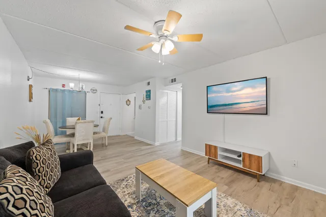 a living room with furniture and a table