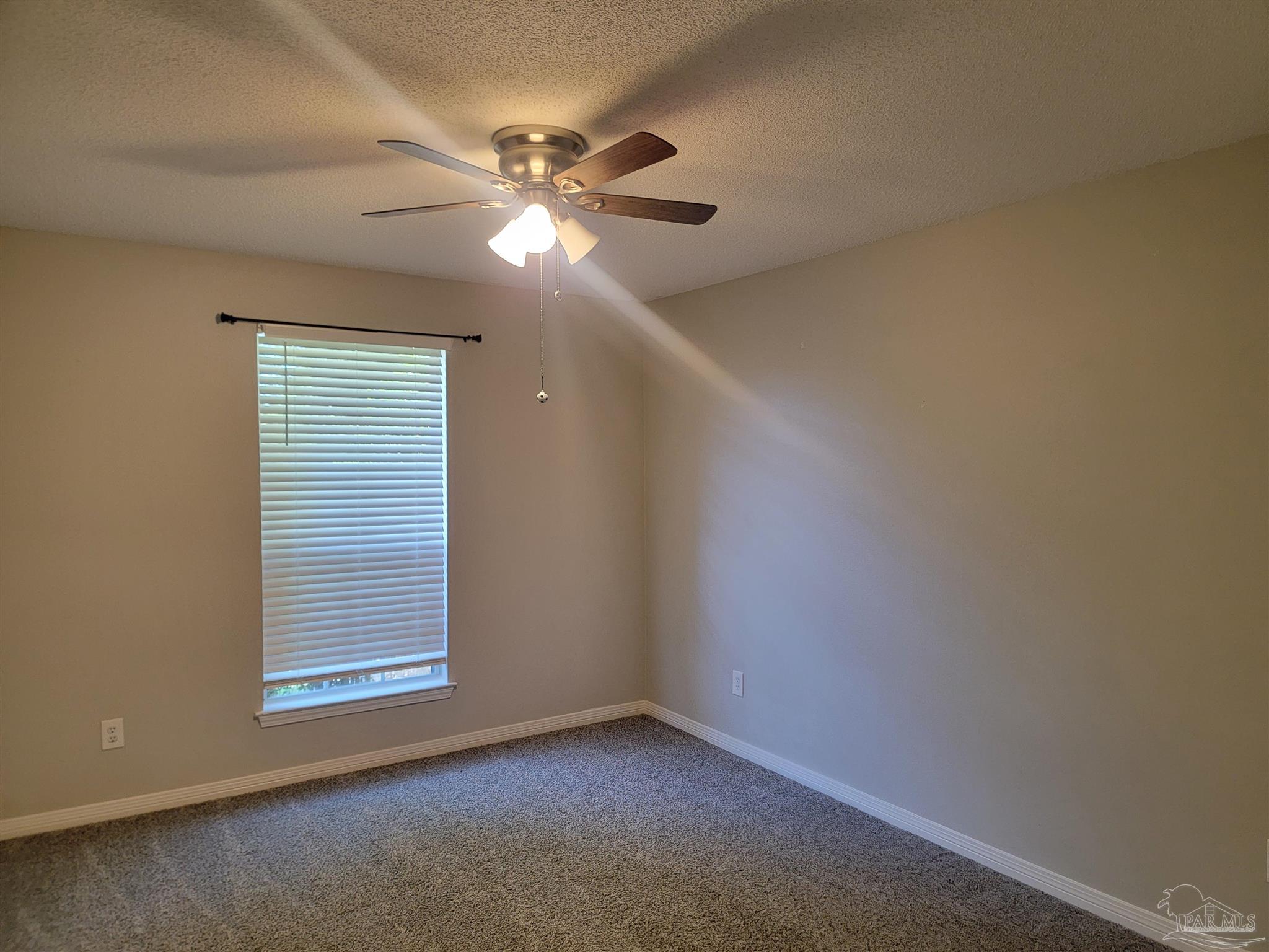 4878 Pineview Ridge Road Pace, FL 32571 - Photo 13 of 20 a view of an empty room with a window