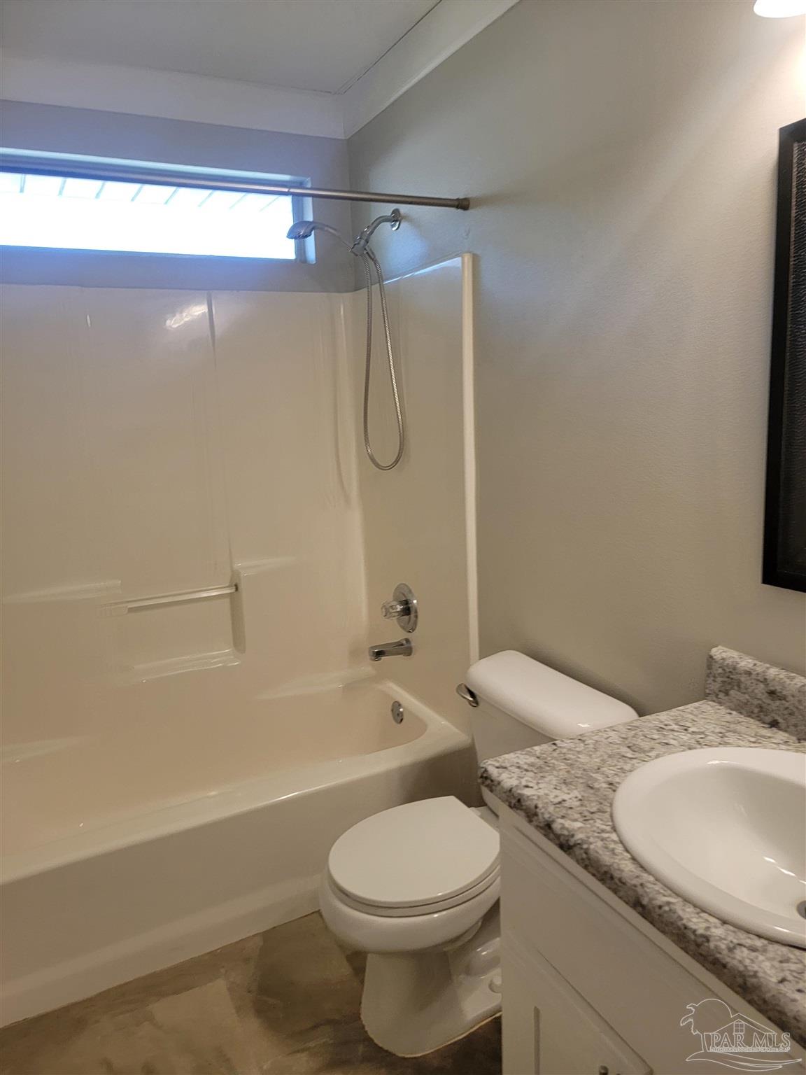 4878 Pineview Ridge Road Pace, FL 32571 - Photo 14 of 20 a bathroom with a granite countertop bathtub shower sink vanity and toilet