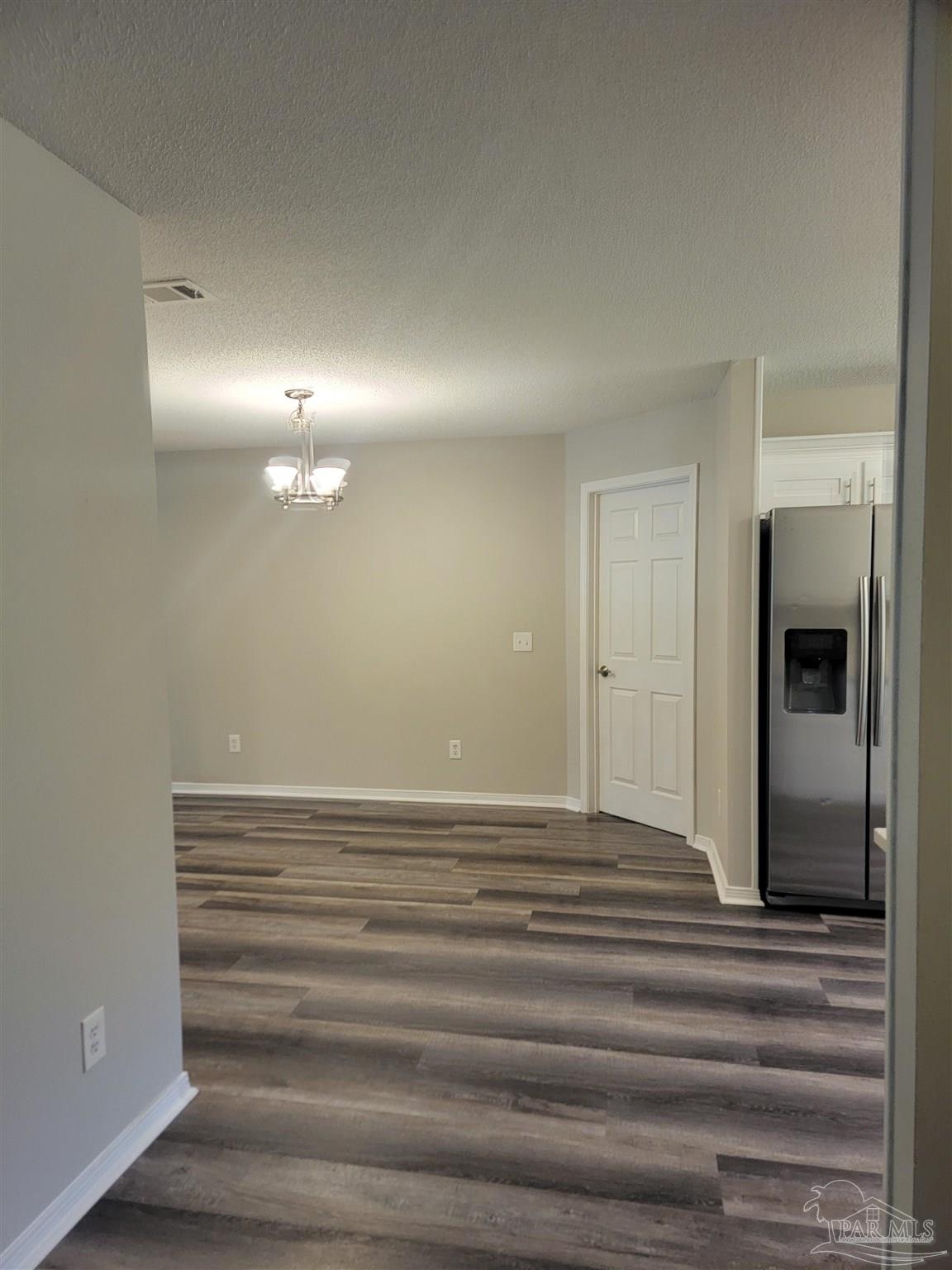4878 Pineview Ridge Road Pace, FL 32571 - Photo 4 of 20 a view of a room with wooden floor