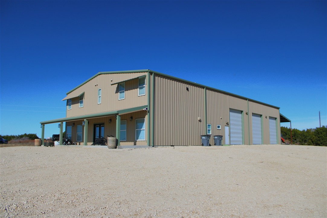 1684 County Road 2234 Lampasas, TX 76550 - Photo 12 of 35 a front view of a house with large windows