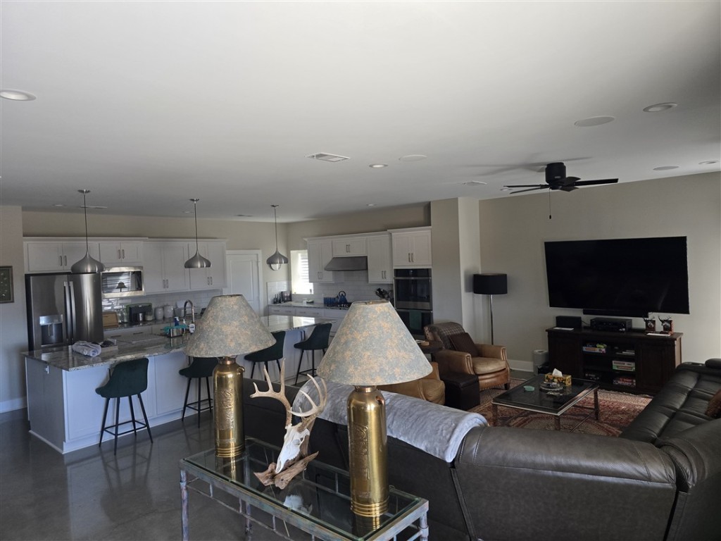 1684 County Road 2234 Lampasas, TX 76550 - Photo 17 of 35 a living room with furniture and a flat screen tv