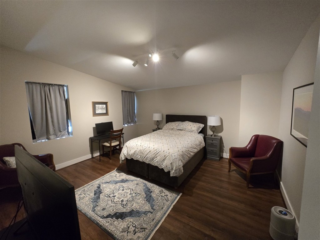 1684 County Road 2234 Lampasas, TX 76550 - Photo 23 of 35 a bedroom with bed and wooden floor