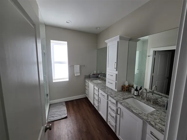 a bedroom with double bed and a window