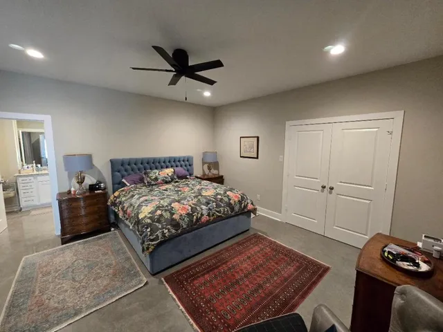 a bathroom with a double vanity sink toilet and shower