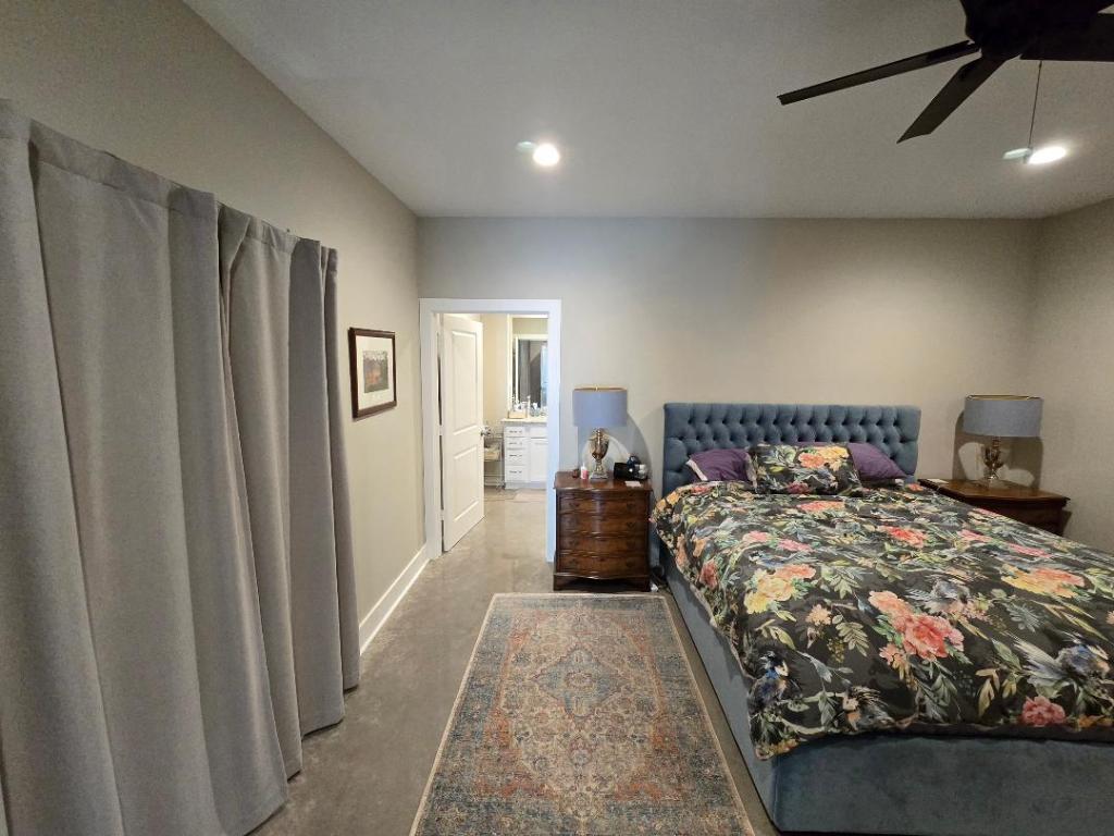 1684 County Road 2234 Lampasas, TX 76550 - Photo 29 of 35 a bedroom with a bed and a window