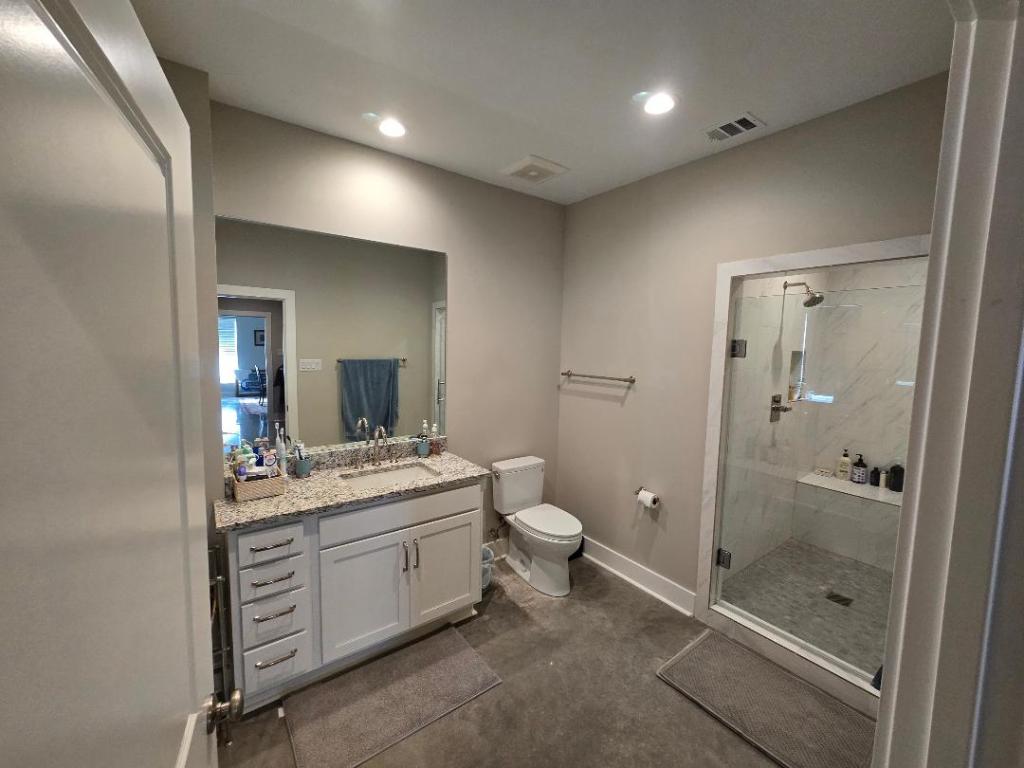 1684 County Road 2234 Lampasas, TX 76550 - Photo 30 of 35 a bathroom with a double vanity sink toilet and shower