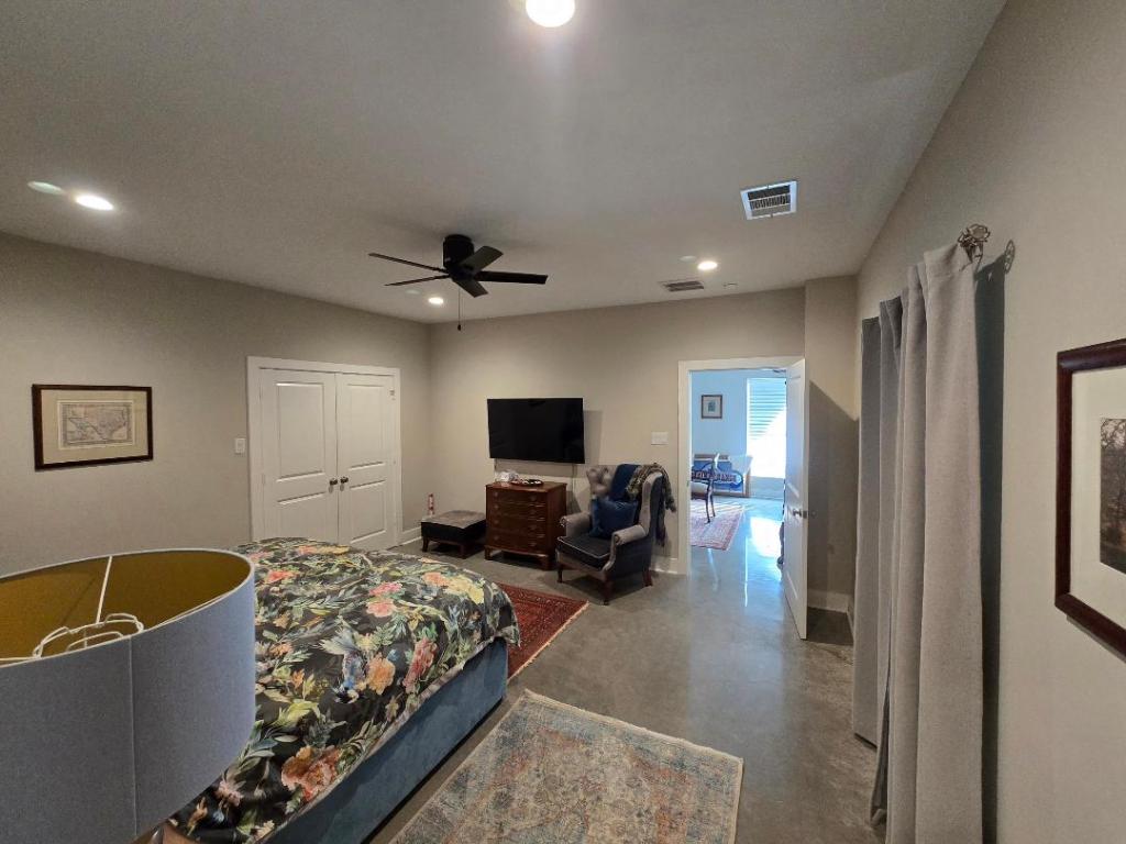 1684 County Road 2234 Lampasas, TX 76550 - Photo 31 of 35 a living room with furniture and a flat screen tv