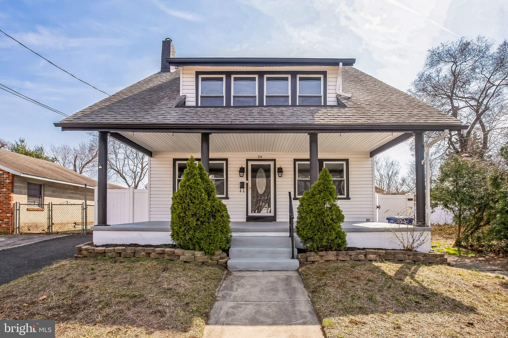 24 Cuthbert Road Cinnaminson, NJ 08077 - Photo 2 of 30 a front view of a house with garden