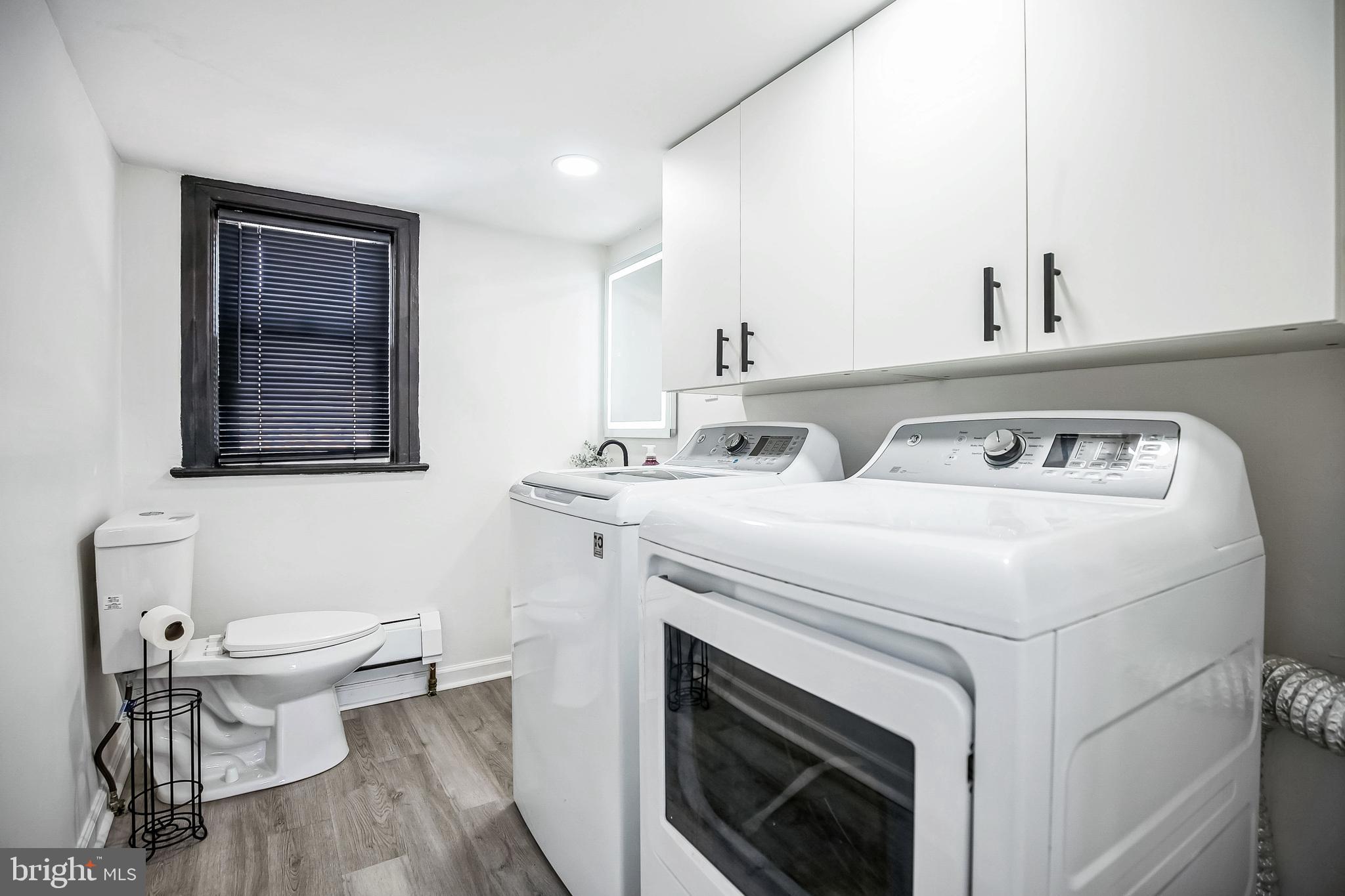 24 Cuthbert Road Cinnaminson, NJ 08077 - Photo 21 of 30 a utility room with dryer washer and a view of kitchen