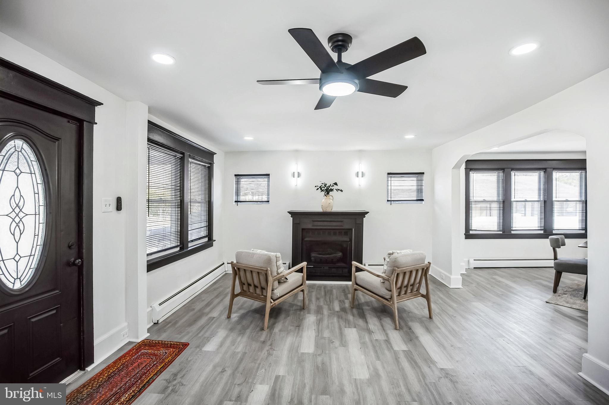 24 Cuthbert Road Cinnaminson, NJ 08077 - Photo 6 of 30 a living room with furniture and a fireplace