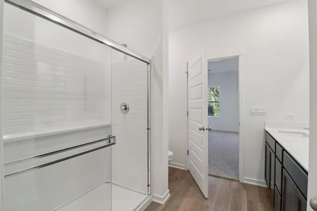 a bathroom with a shower and a sink