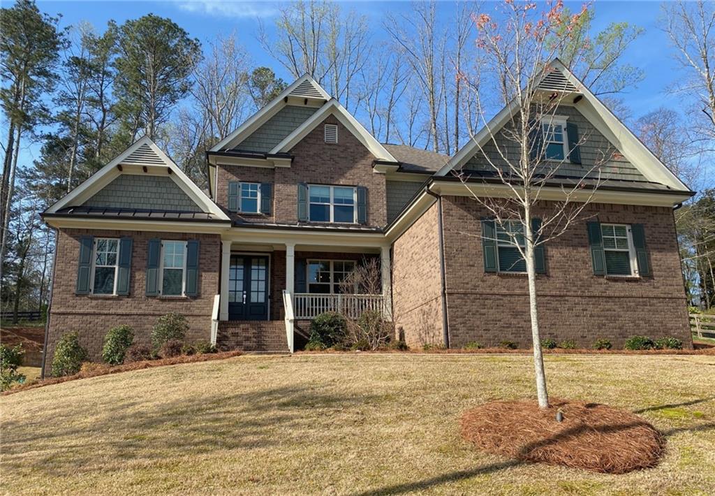 142 Grandmar Chase Canton, GA 30115 - Photo 1 of 1 a front view of a house with plants