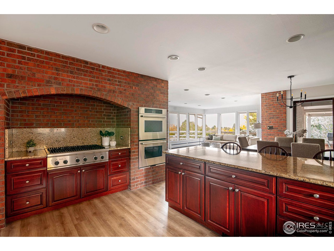 19 Ridge Road Boulder, CO 80303 - Photo 14 of 40 a kitchen with stainless steel appliances granite countertop a stove a sink and a wooden cabinets