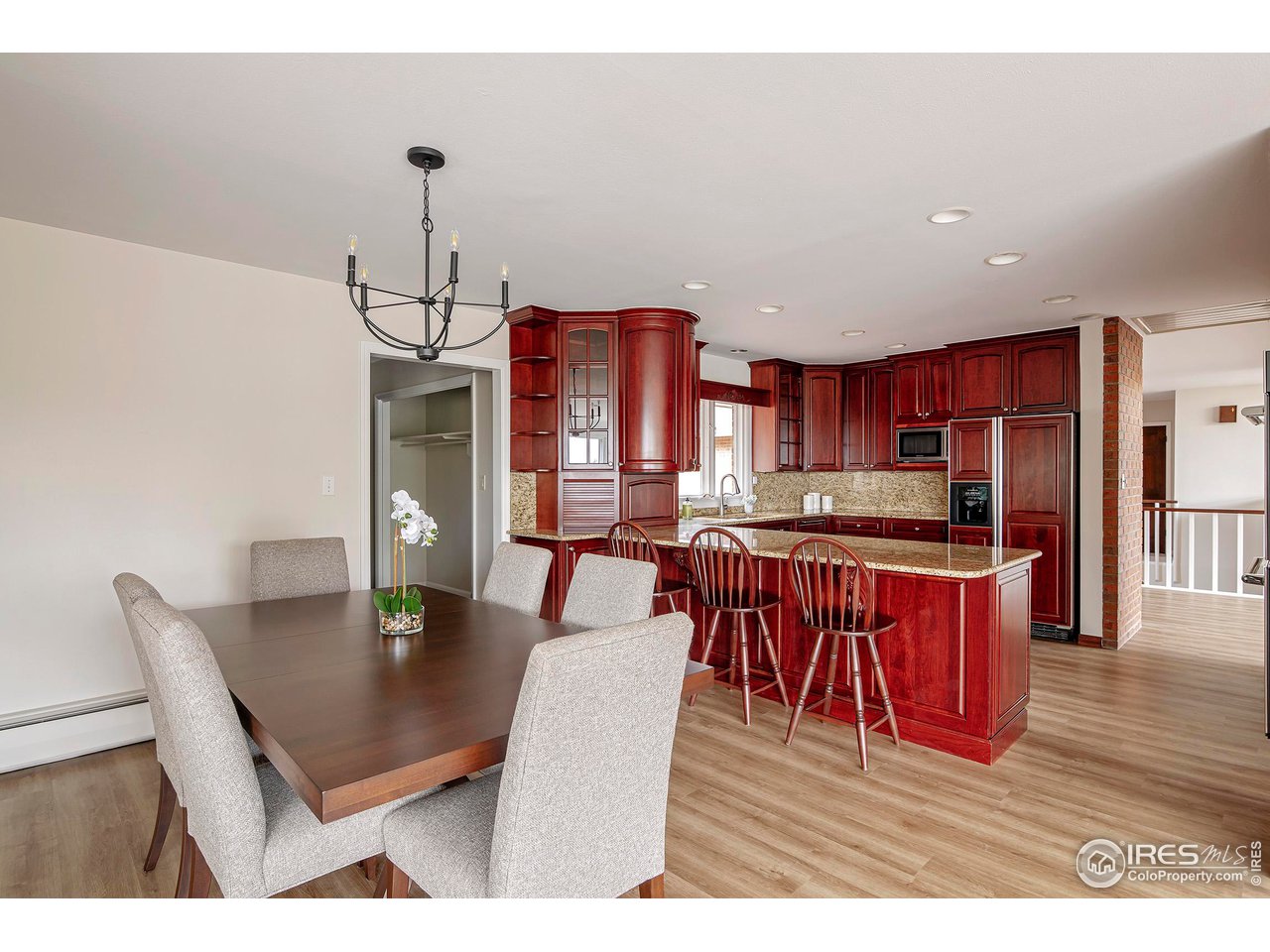 19 Ridge Road Boulder, CO 80303 - Photo 18 of 40 a dining room with stainless steel appliances kitchen island granite countertop a dining table and chairs