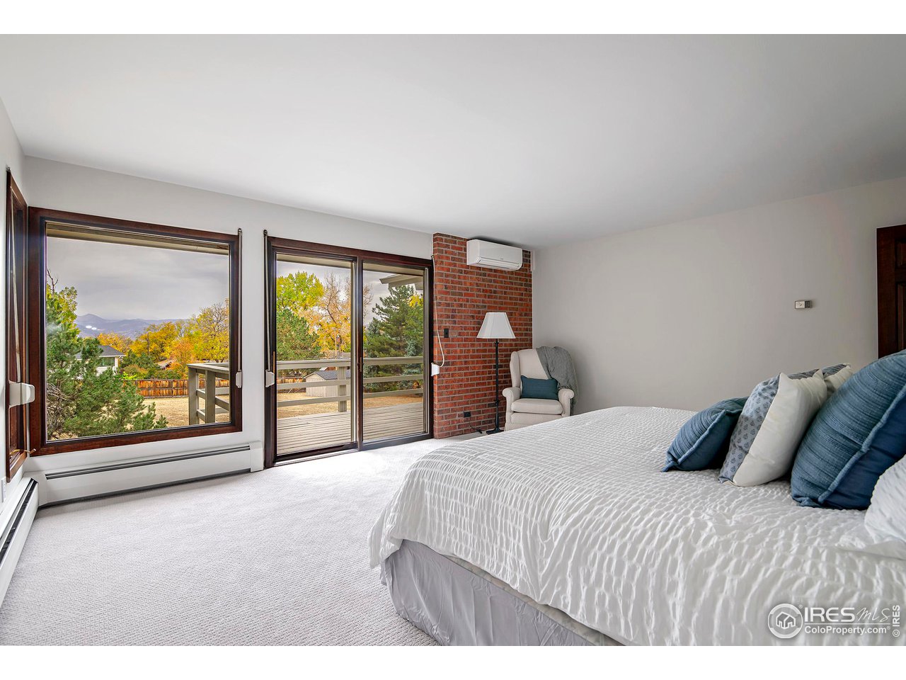 19 Ridge Road Boulder, CO 80303 - Photo 22 of 40 a bedroom with a large bed and a large window