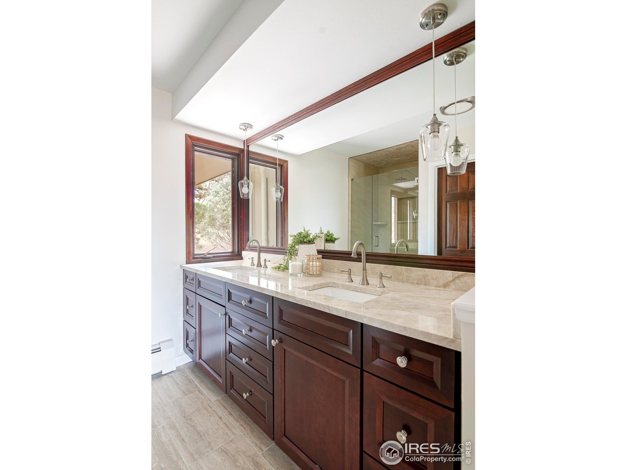 19 Ridge Road Boulder, CO 80303 - Photo 26 of 40 a bathroom with a double vanity sink and a mirror