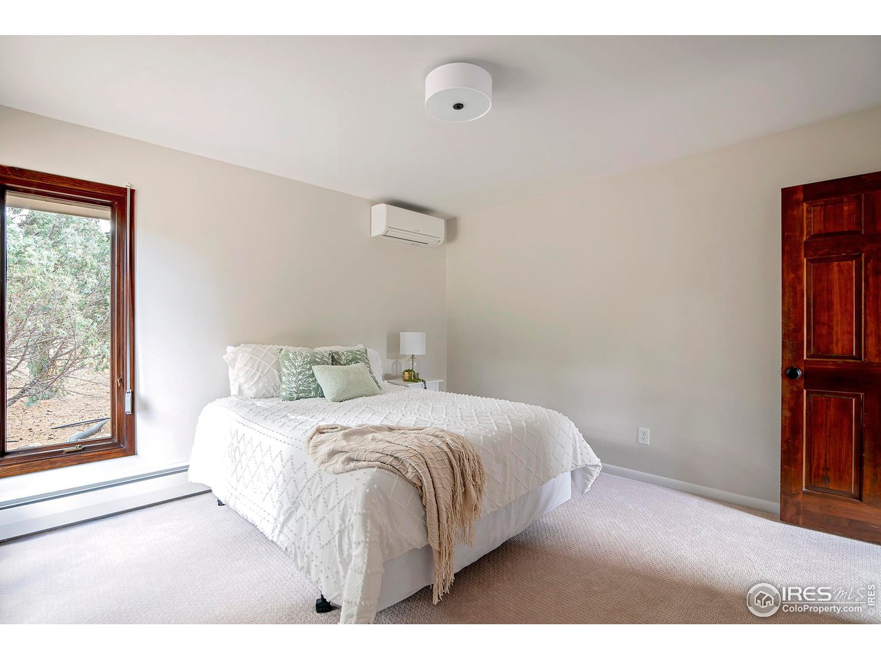 19 Ridge Road Boulder, CO 80303 - Photo 30 of 40 a bedroom with a bed and a large window