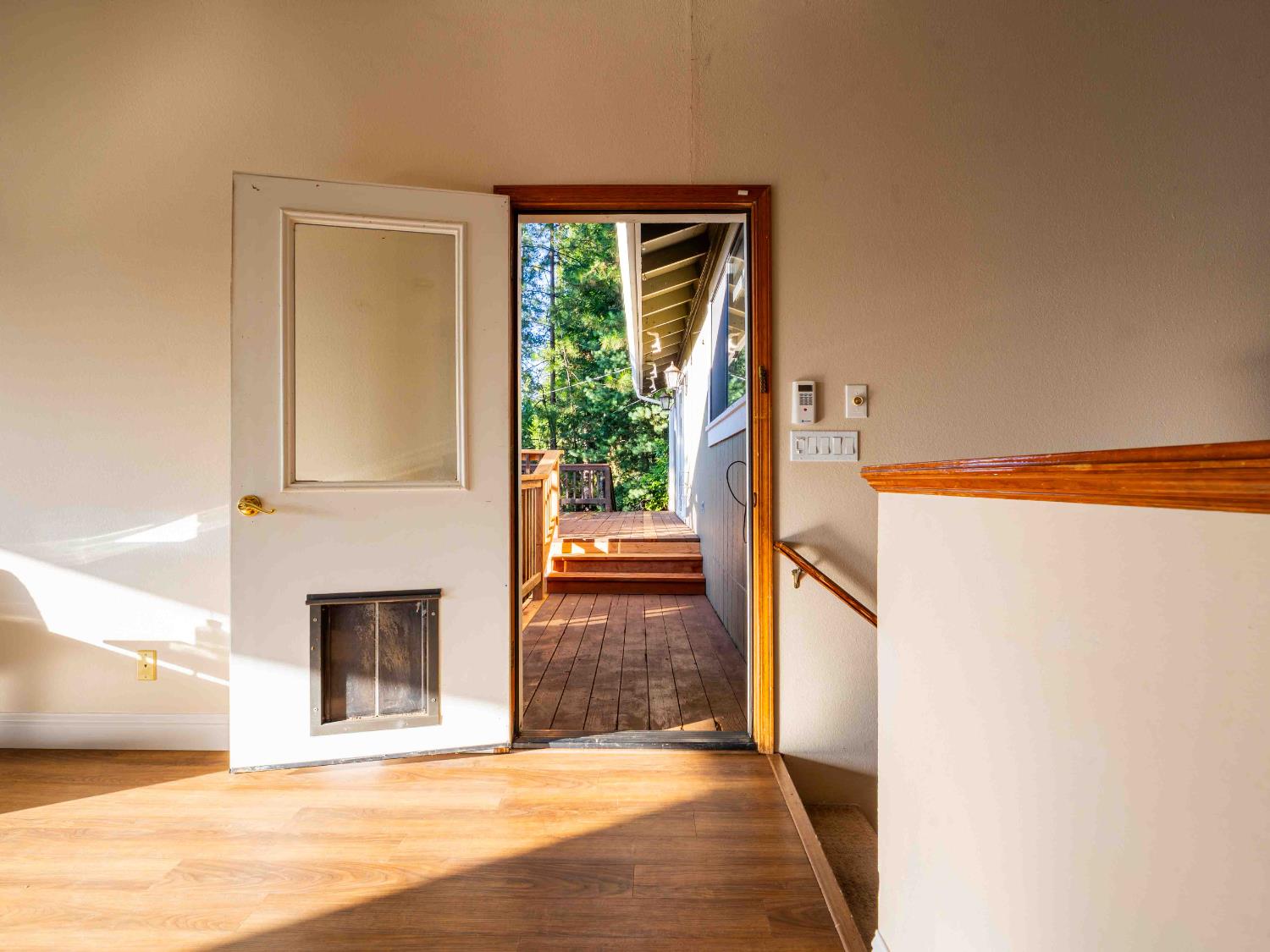 11419 Sunset Place Grass Valley, CA 95949 - Photo 15 of 47 a view of an entryway with wooden floor and a fireplace