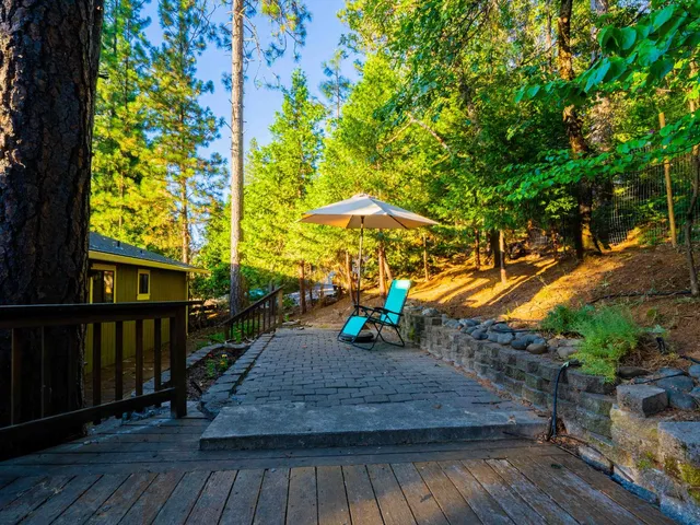 a view of a wooden deck with a yard