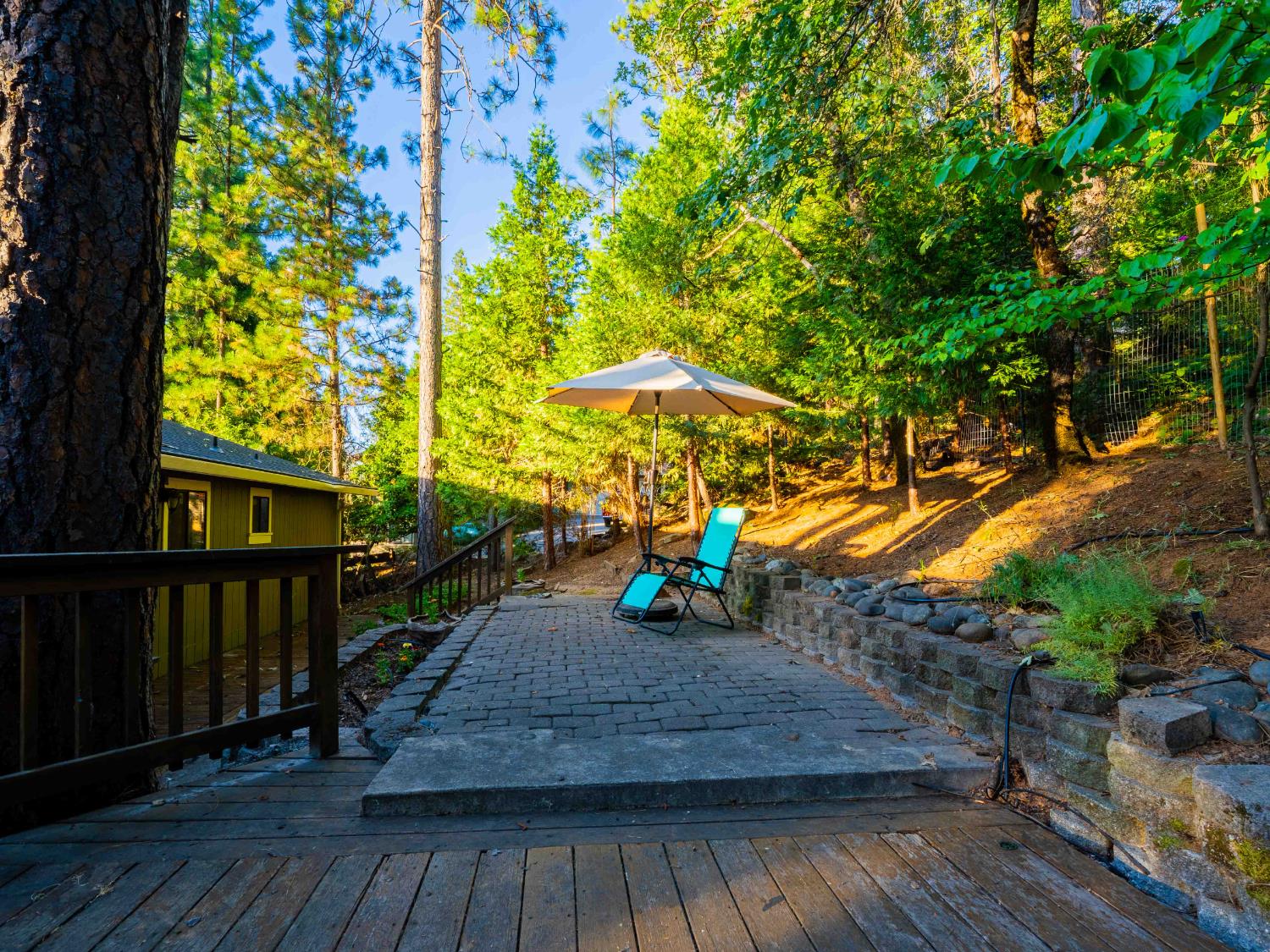 11419 Sunset Place Grass Valley, CA 95949 - Photo 17 of 47 a view of a wooden deck with a yard