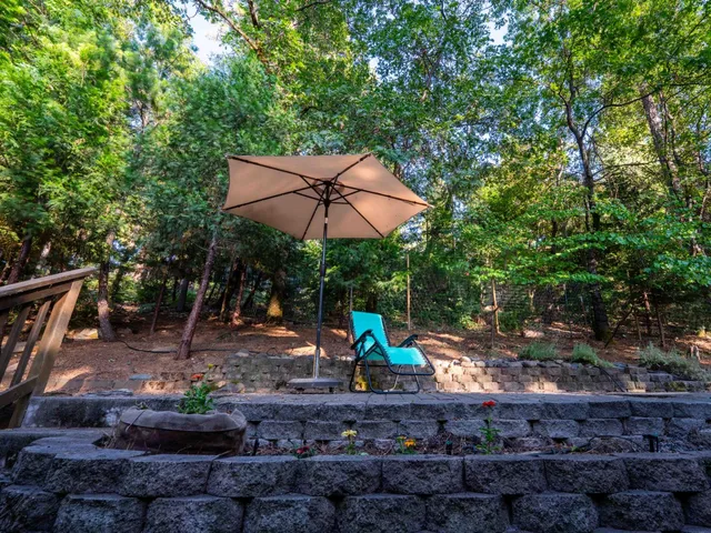 a view of a park with a slide and table