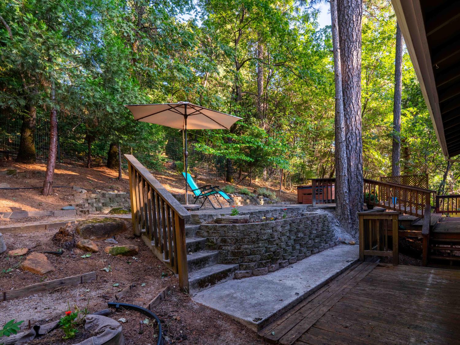 11419 Sunset Place Grass Valley, CA 95949 - Photo 21 of 47 a view of a wooden deck with chairs and floor