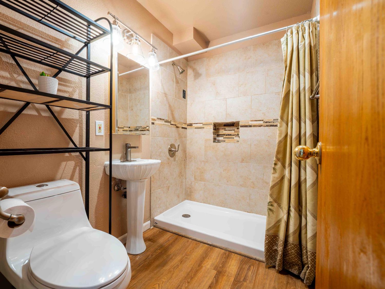 11419 Sunset Place Grass Valley, CA 95949 - Photo 27 of 47 a bathroom with a toilet and a shower