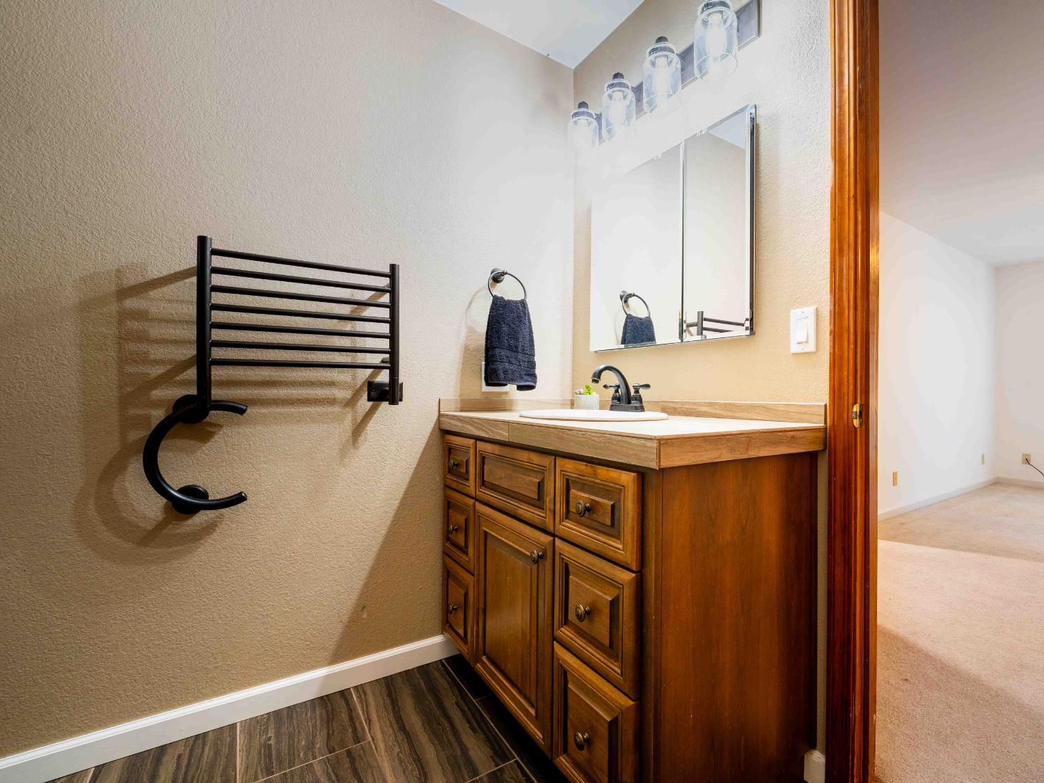 11419 Sunset Place Grass Valley, CA 95949 - Photo 30 of 47 a bathroom with a sink and a mirror