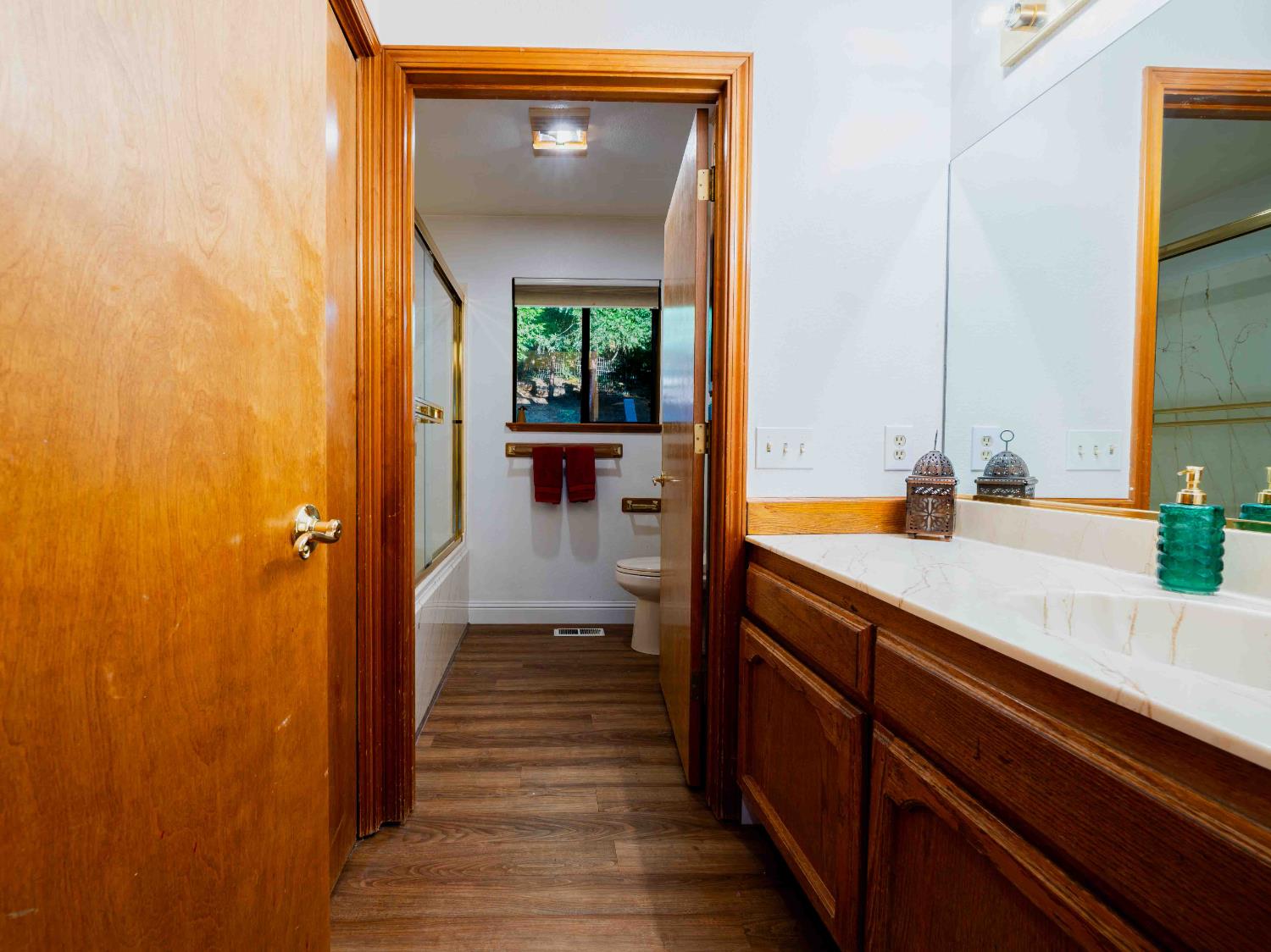 11419 Sunset Place Grass Valley, CA 95949 - Photo 39 of 47 a hallway with a sink and a mirror