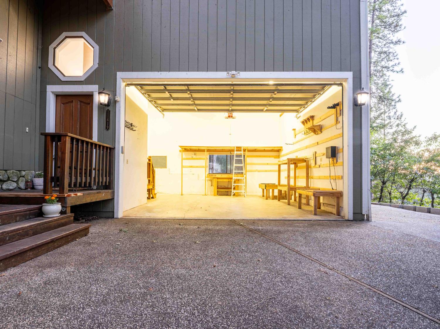 11419 Sunset Place Grass Valley, CA 95949 - Photo 43 of 47 a view of an empty room with a fireplace and a large window