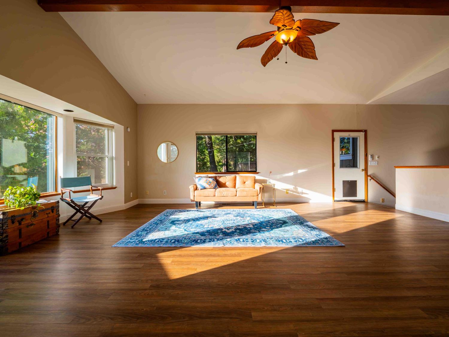 11419 Sunset Place Grass Valley, CA 95949 - Photo 6 of 47 a living room with couch chandelier and wooden floor