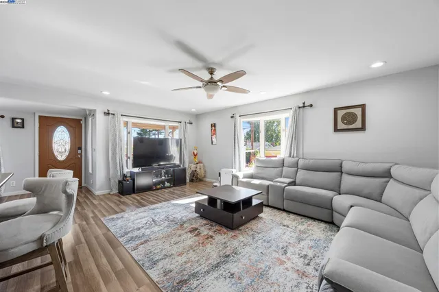 a living room with furniture or couch and a flat screen tv