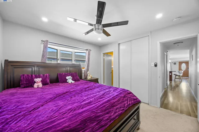 a bed room with a bed and a large mirror