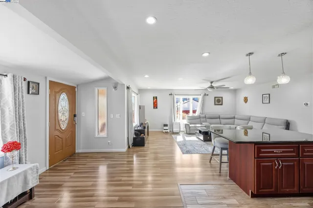 a large room with lots of counter space and windows